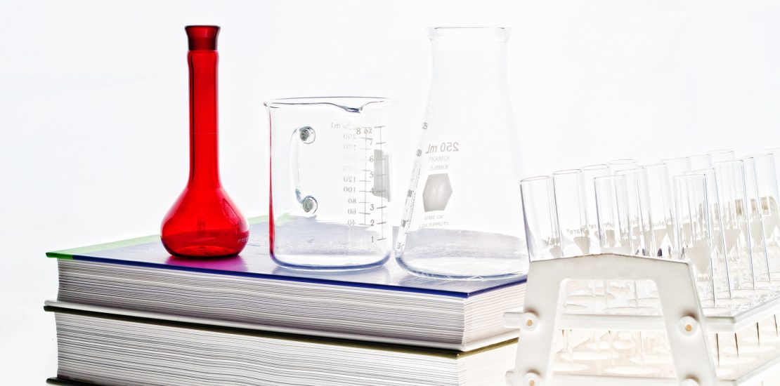 Chemistry book and glassware